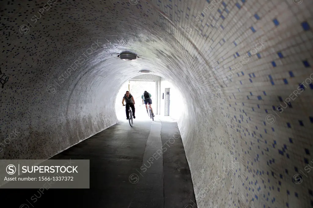Cyclists in the underground passage, Budapest, Hungary.