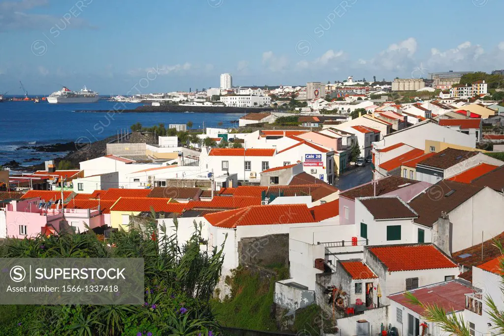 The parish of Sao Roque, with a cruise ship entering the port of Ponta Delgada on the background. Sao Miguel island, Azores, Portugal.