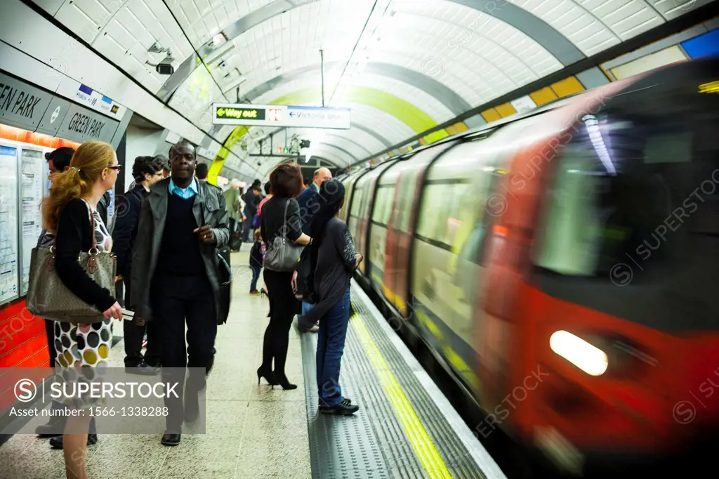 People waiting train in rush hour, London underground, UK