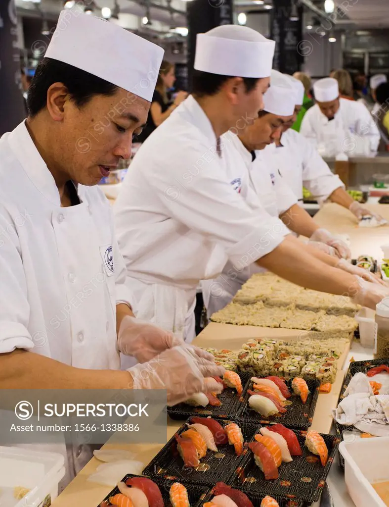 Chefs prepare sushi in the Chelsea Market, Chelsea, Manhattan, New York, New York City, United States, USA.