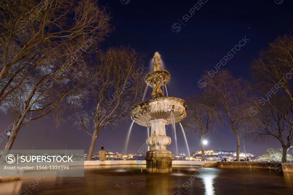 Fountain in the night at miradouro San Pedro de Alcantara of Bairro Alto, Lisbon, Portugal.