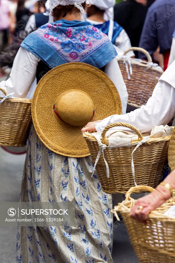 Europe, France, Alpes-de-Haute-Provence, 04, Regional Natural Park of Verdon, Valensole. Provencal lavender festival. Washerwomen with their basket. D...