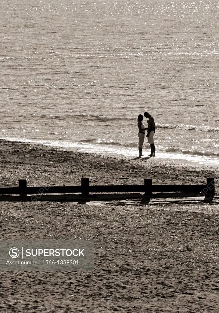 young couple at the seaside, sandy beach, Atlantic Ocean, Cabourg, Calvados, Basse Normandie, Normandy, France.