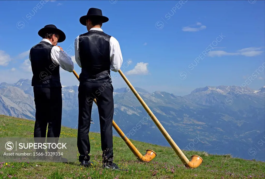 Two men with alphorns, Swiss Alps, Nendaz, canton Valais, canton Wallis, Switzerland