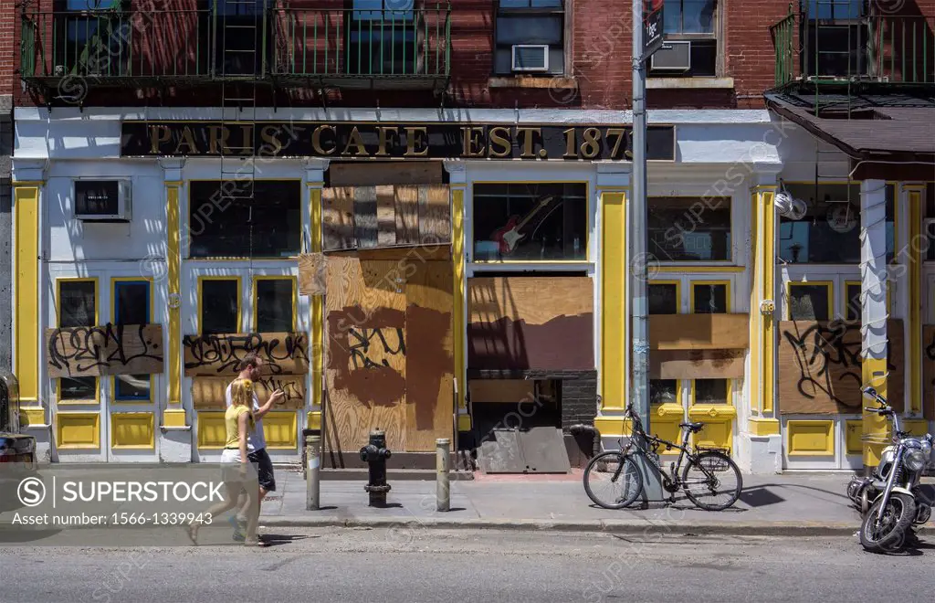 The boarded up Paris Cafe on South Street in the South Street Seaport historic district in New York when it is usually teeming with tourists. The area...