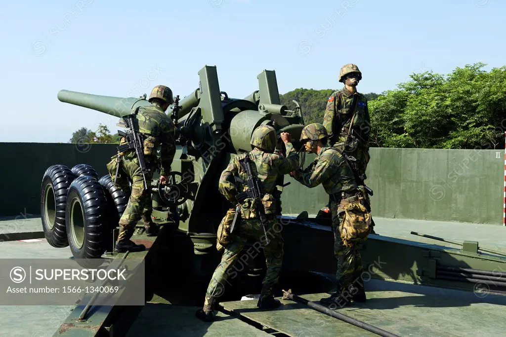 The Taiwan Military soldiers performing positional and firing drills on a US made, 1930's designed M1 155mm Long Tom howitzer.