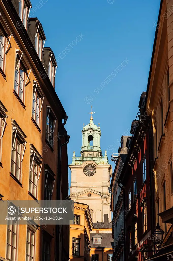 Tower from Church of St. Nicholas - Storkyrkan - Stockholm Cathedral rises between buildings, Gamla Stan - old town, Stockholm, Sweden.