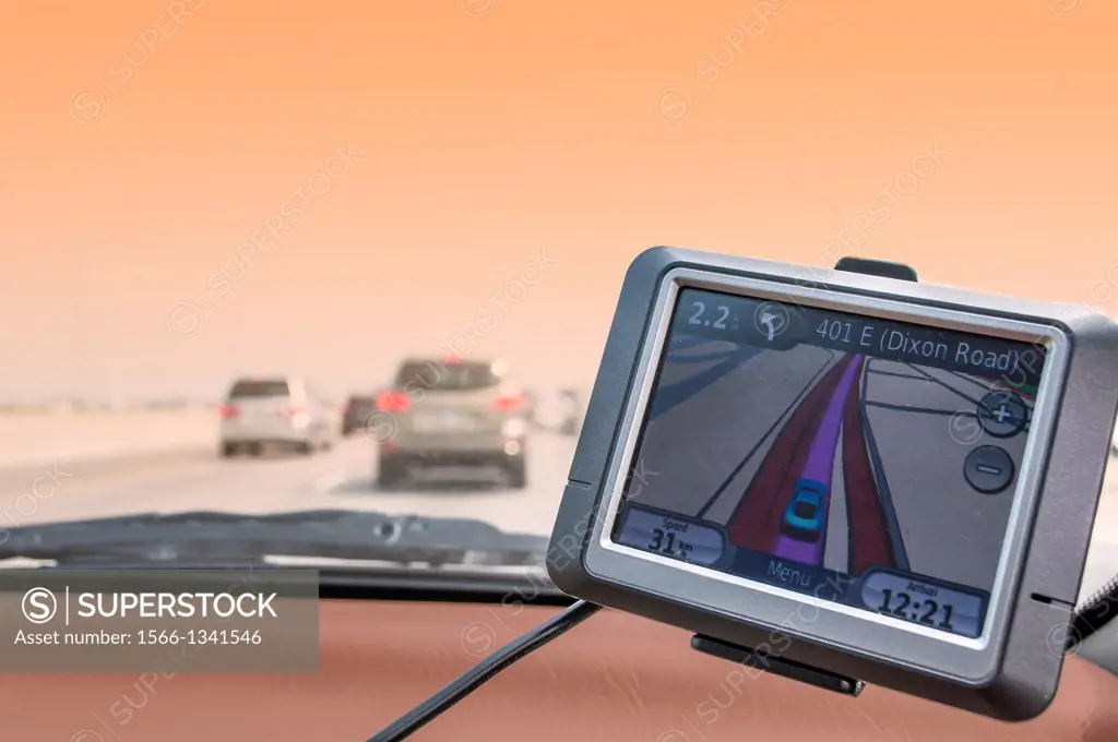 A GPS device guides a motorist in driving on Canada's main thoroughare, Highway 401.