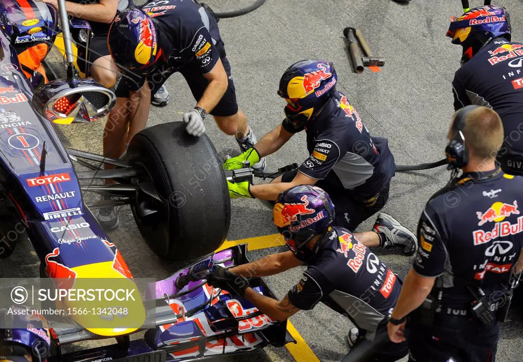 Red Bull Mechanics change tire during pit-stop during the Formula One Grand Prix of Spain on Circuit de Catalunya race track in Montmelo near Barcelon...
