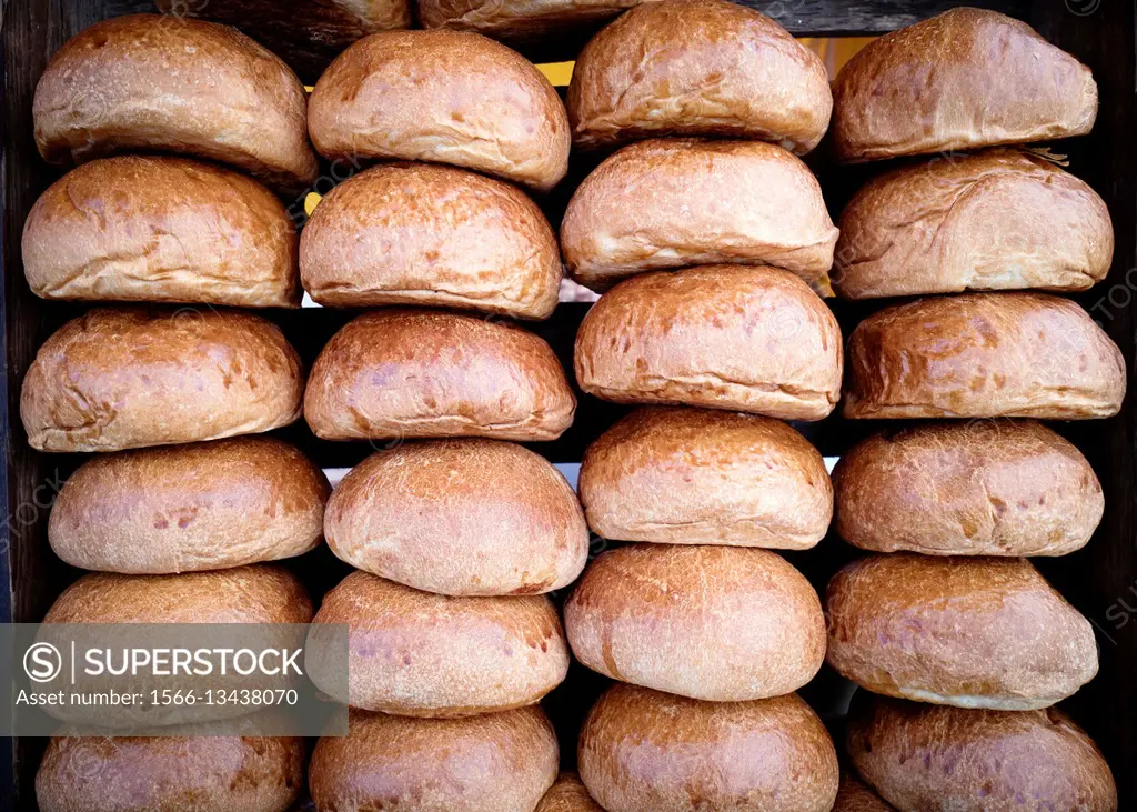 Close up of bread rolls neatly stacked