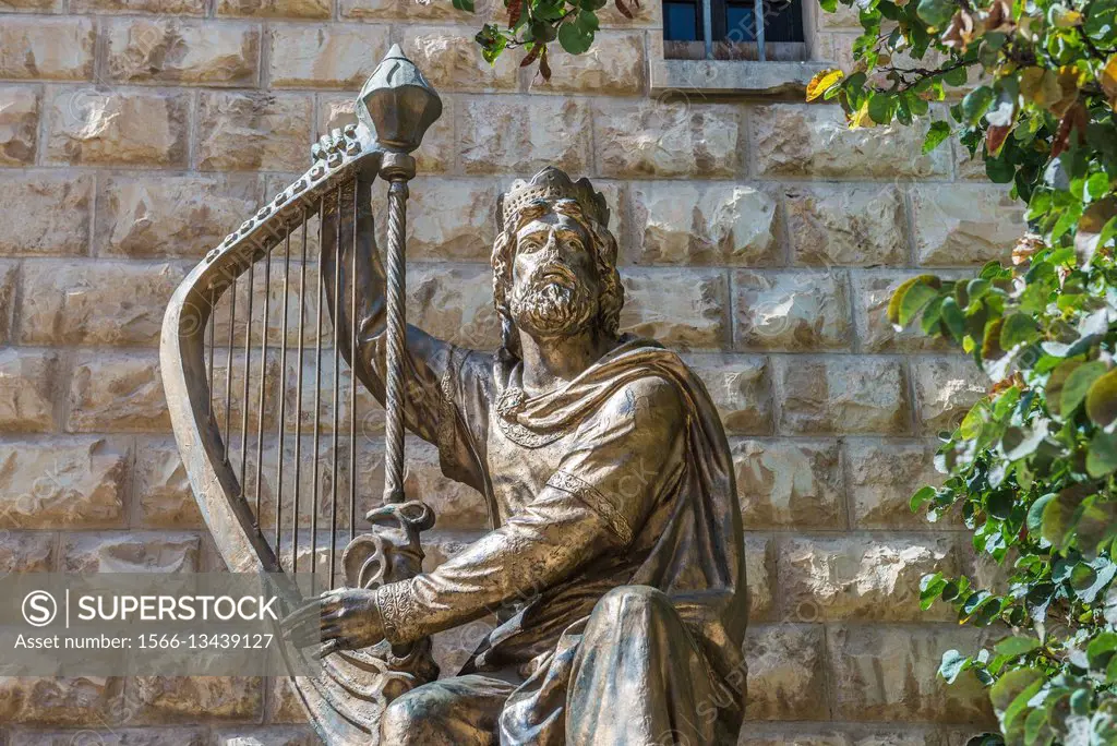 King David statue in front of Benedictine Abbey of the Dormition on the Mount Zion in Jerusalem, Israel.