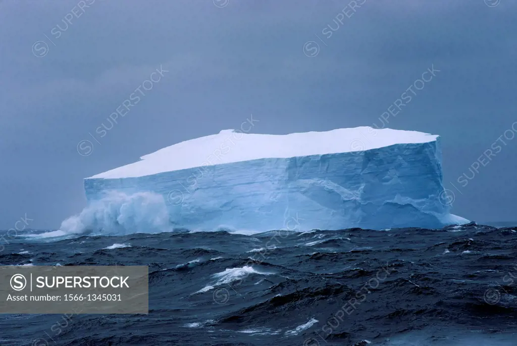 ANTARCTICA, ICEBERG IN ROUGH SEAS.
