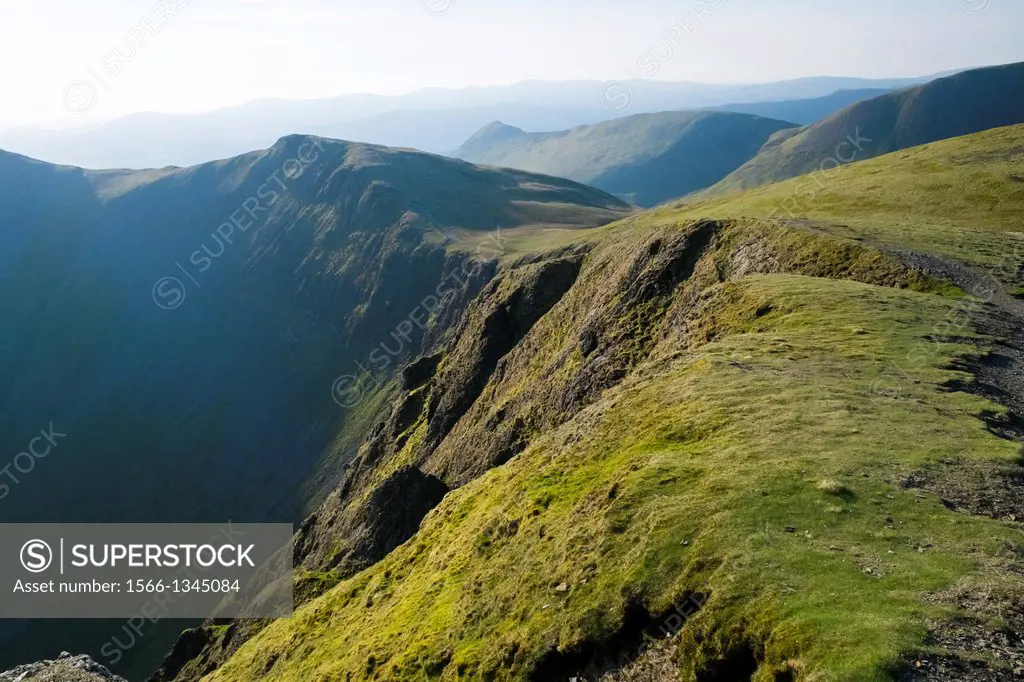 Looking towards Hobcarton Crags from the summit of Hopegill Head at sunrise in the Lake District.
