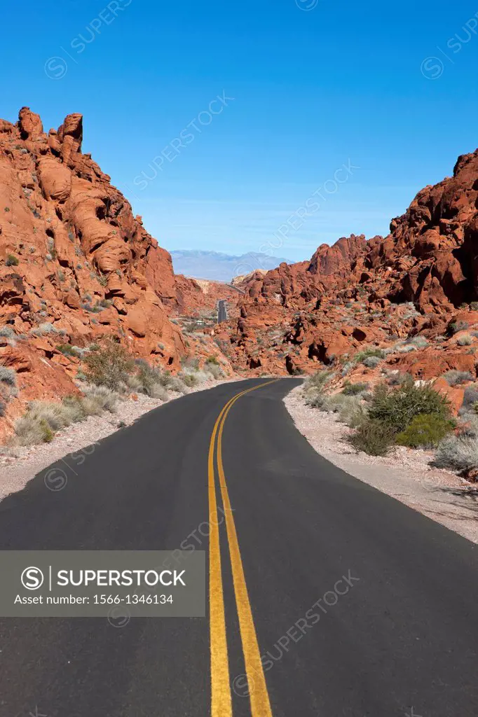 Valley of Fire Road with red sandstone formations in the background, Valley of Fire State Park, Nevada, United States of America.
