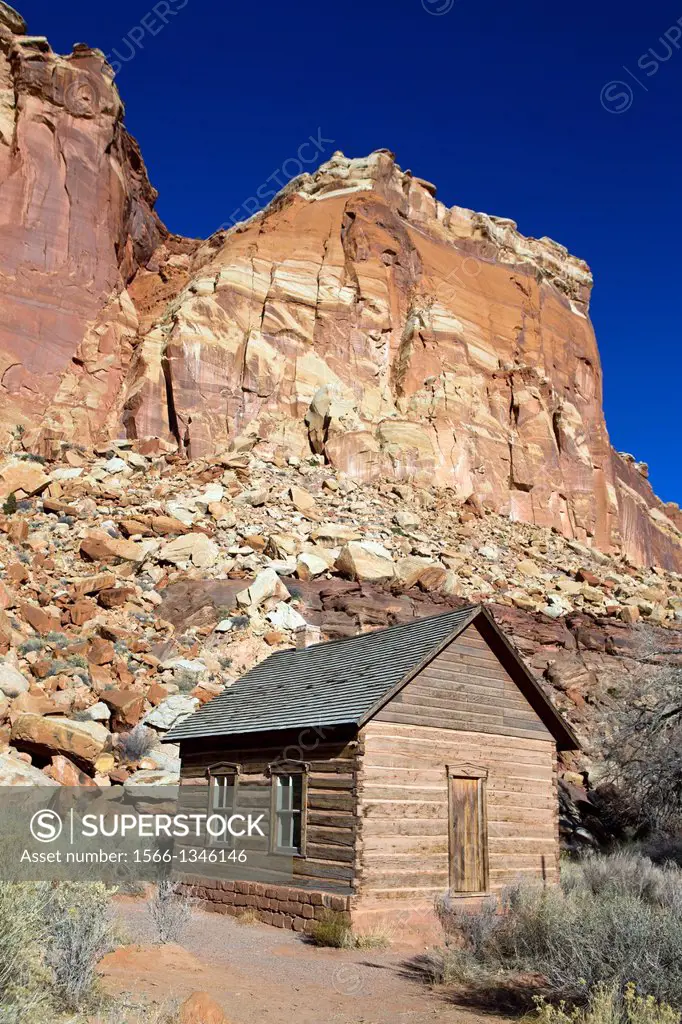 One-room Frutia Schoolhouse with colorful sandstone rock formations, Historic Fruita, Capitol Reef National Park, Utah, United States of America.