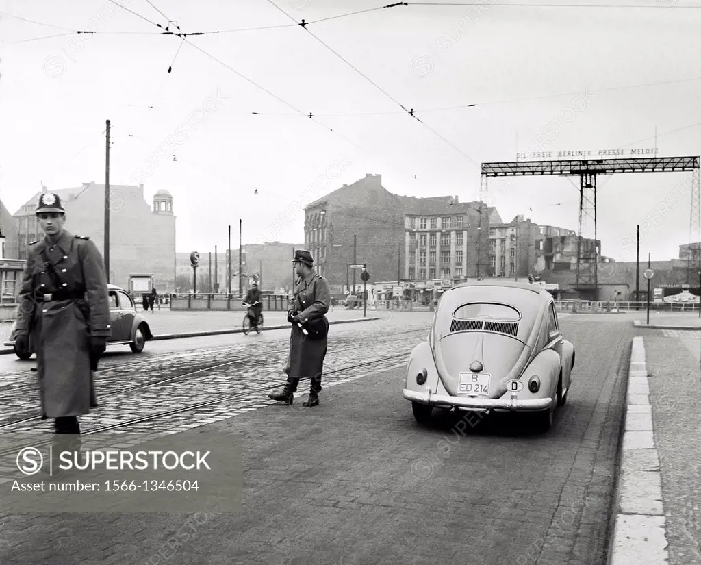1959 Volkspolizei East German people´s police controlling cars at Leipziger Platz square East Berlin Germany.