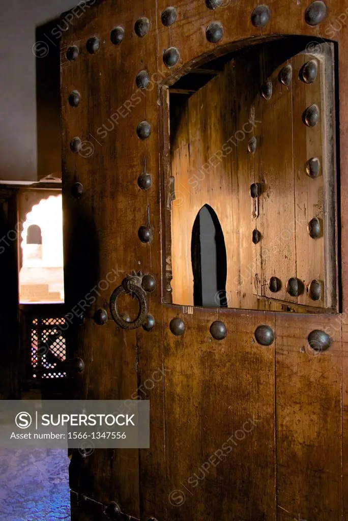 Wooden door, Student room,Window and arch, Medersa Ben Youssef, 1570,arabo-andalusian architecture, coranic school, Marrakech, Morroco.