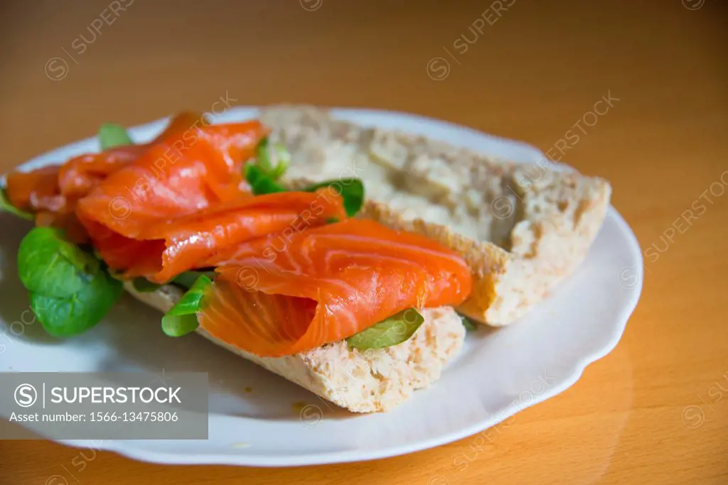 Smoked salmon on sliced bread. Close view.