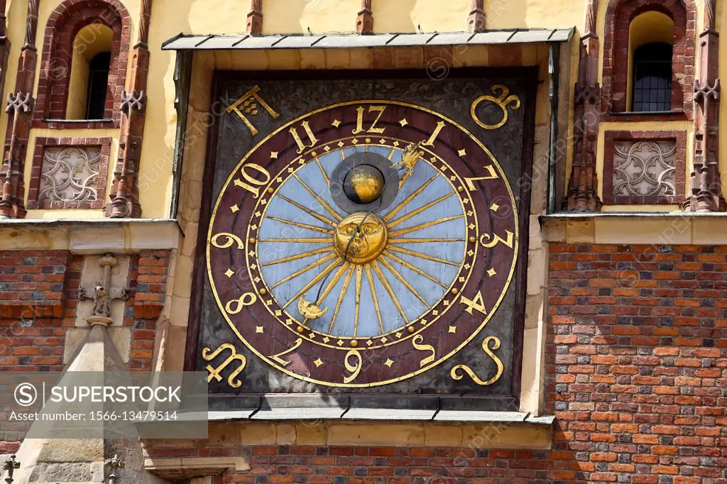 Clock at the town hall facade in Wroclaw, Poland