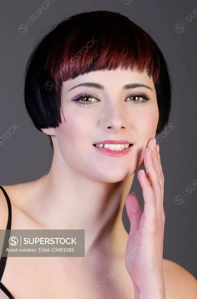 Beautiful young woman with short hair smiling.
