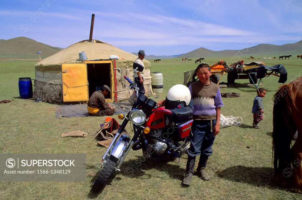 MONGOLIA, NEAR ULAN BATOR, GRASSLAND, MOTOR BIKE IN FRONT OF GER (YURT).