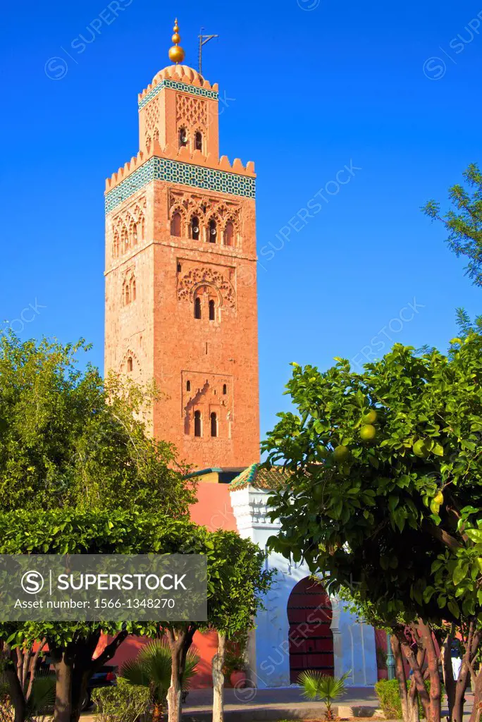 Minaret, Koutoubia Mosque 1147, with palm trees, Marrakech, Morocco.