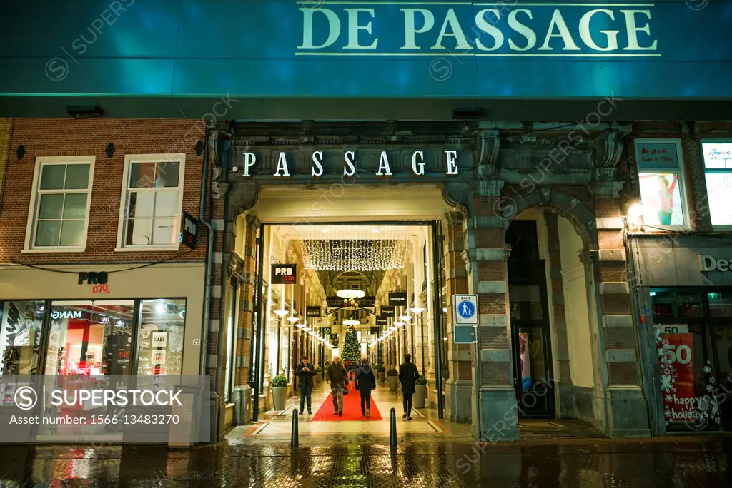 Netherlands, The Hague, De Passage, 19th century shopping arcade, sign, dusk.