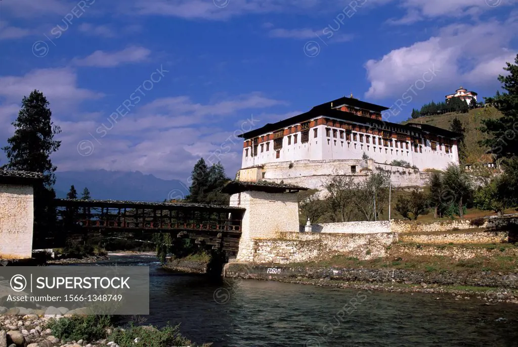 BHUTAN, PARO, VIEW OF RINPONG DZONG WITH ANCIENT WOODEN BRIDGE.