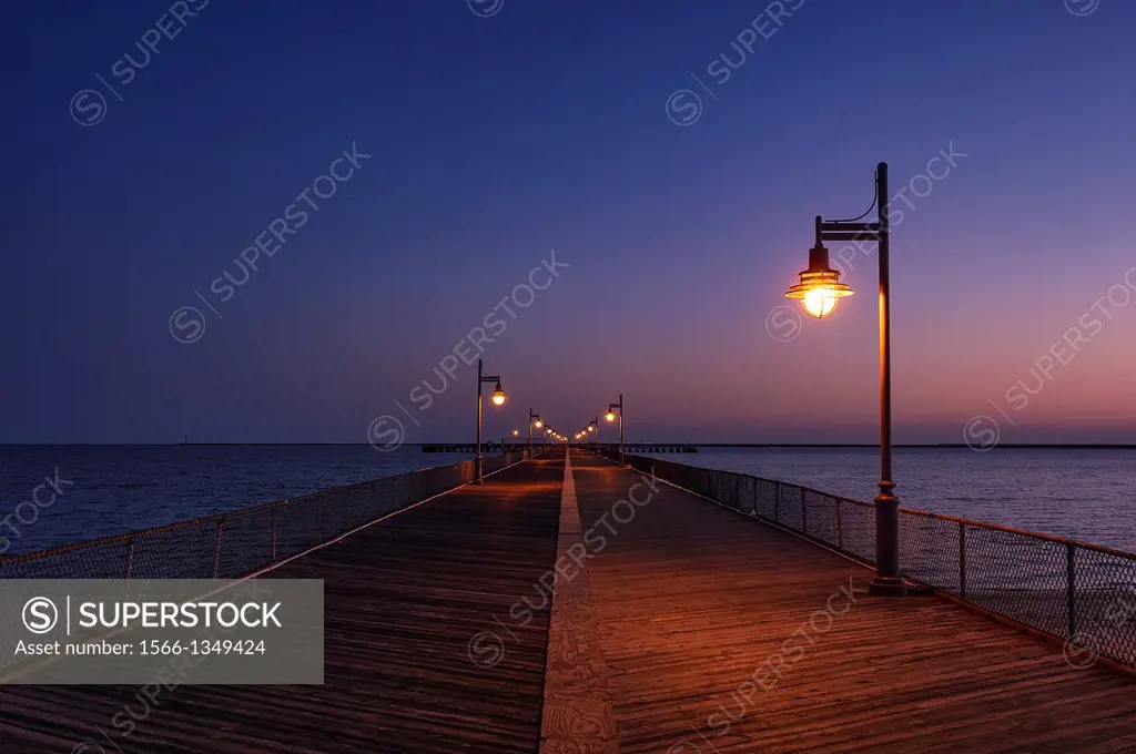 Boardwalk pier at night. Cape Helopen State Park, Delaware.