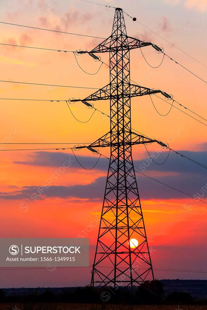 High Voltage electricity transmission tower, electricity pylon, at sunset taken near Sanahuja on the la Segarra area, Lleida province, Catalonia, Spai...