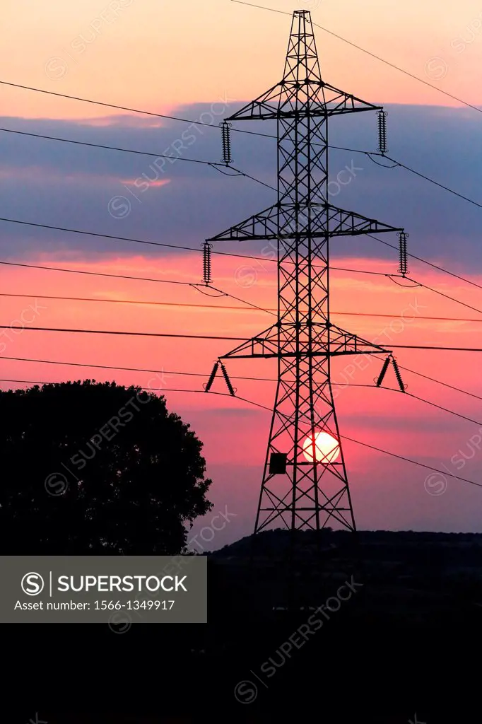 High Voltage electricity transmission tower, electricity pylon, at sunset taken near Sanahuja on the la Segarra area, Lleida province, Catalonia, Spai...