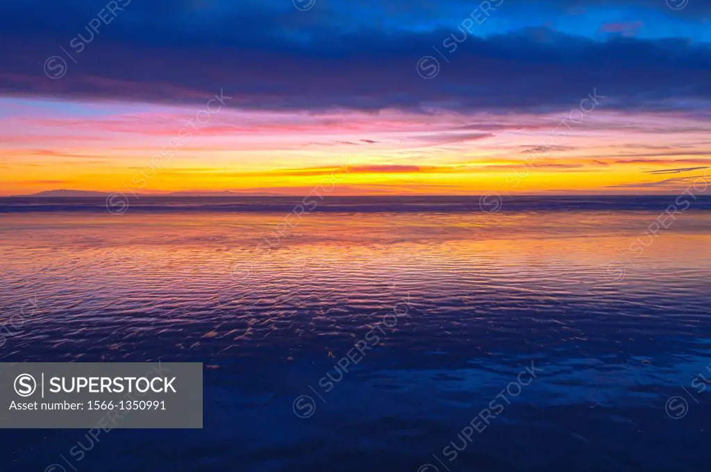 Low tide and sunset over Santa Cruz Island, Channel Islands National Park, Ventura, California USA.