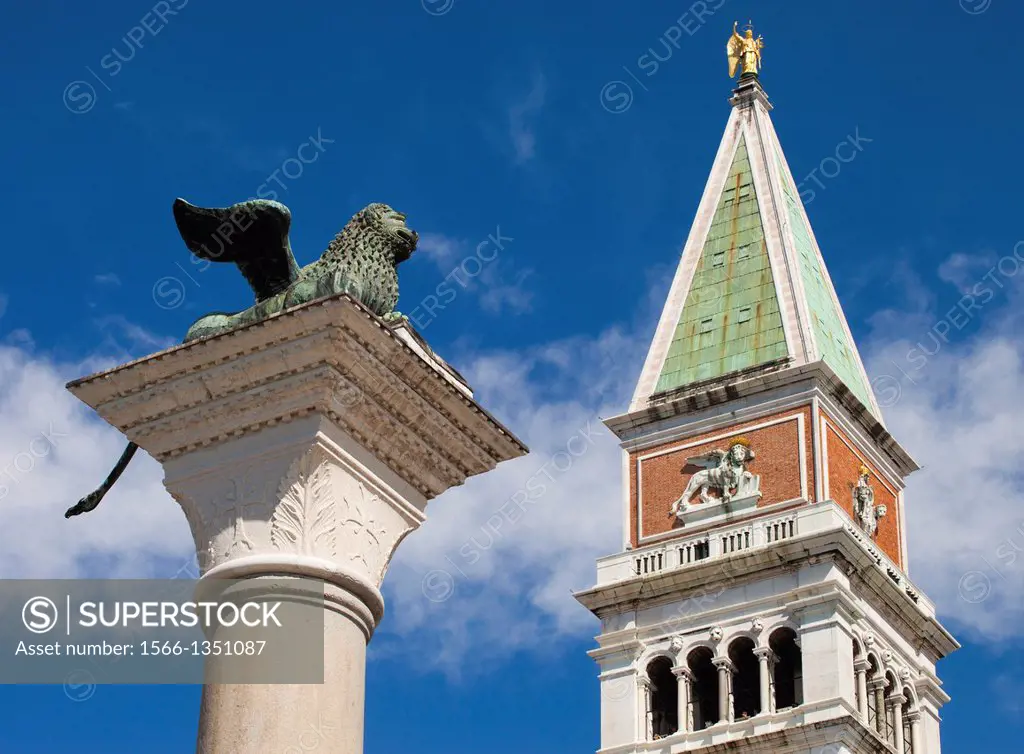 Winged Lion column, St Mark Bell Tower or Campanile in background, St Mark´s square, Venice, Veneto, Italy, Europe.