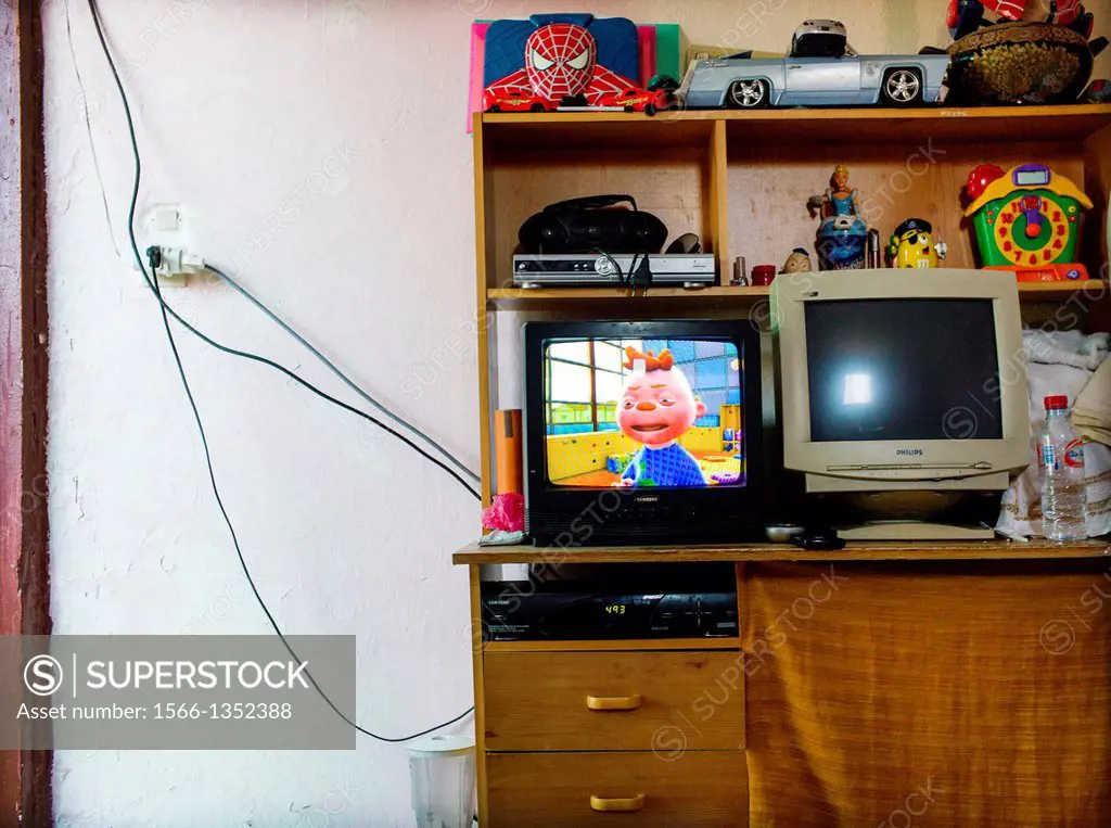 child bedroom with TV, Computer and toys on a shelf in Marrakech, Morocco, Africa