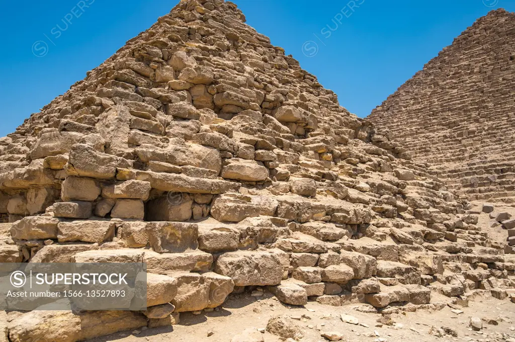 Cairo, Egypt Close up of a mortuary temple in front of one of the Great pyramids of Giza against a clear blue sky. This particular one is The Pyramid ...