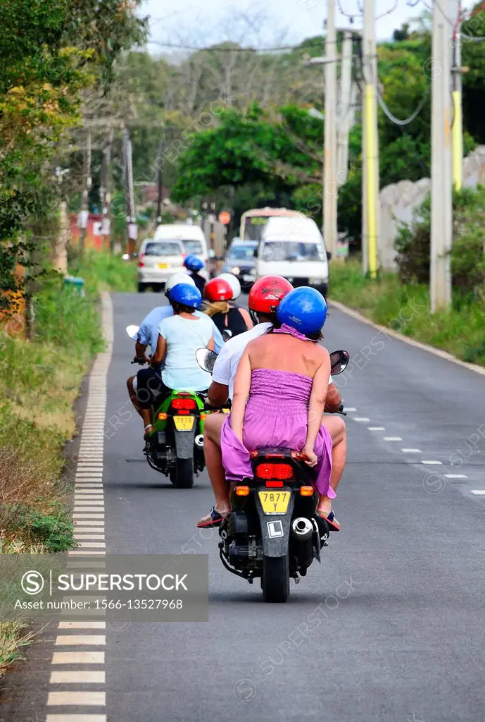 mopeds are very popular way of transportation in Mauritius, here traffic on B29 road from capital - Port Louis to Tombeau Bay, Mauritius, Africa
