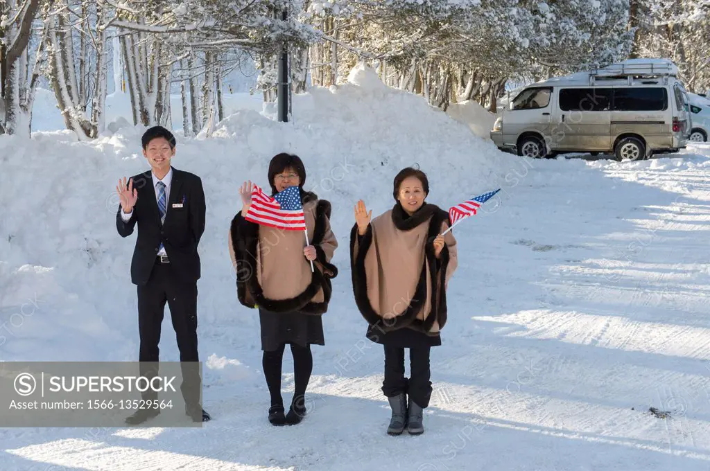 The staff of the Abashirikoso Hotel near Abashiri, a city on Hokkaido Island, Japan, is saying good bye to guests from the United States of America.