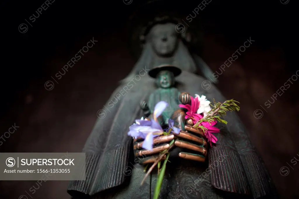 A sculpture of the Virgin of Rocio holding flowers decorates the votive room of her Sanctuary, in Almonte, Donana National Park, Huelva province, Anda...