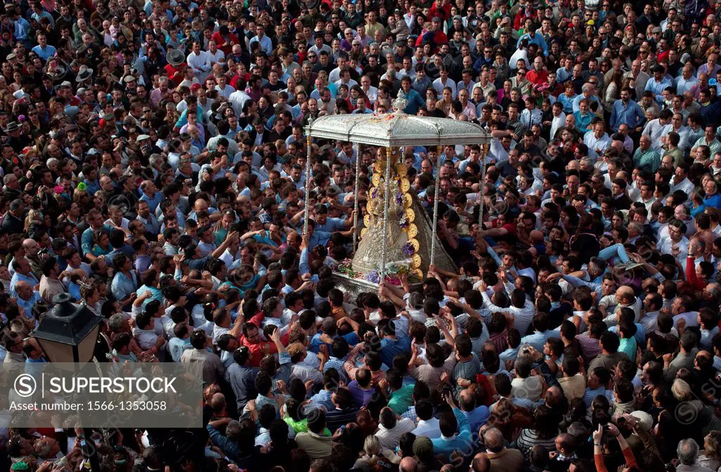 The image of Our Lady of El Rocio is carried by a crow in a procession in El Rocio village, in Almonte, Donana National Park, Huelva province, Andalus...