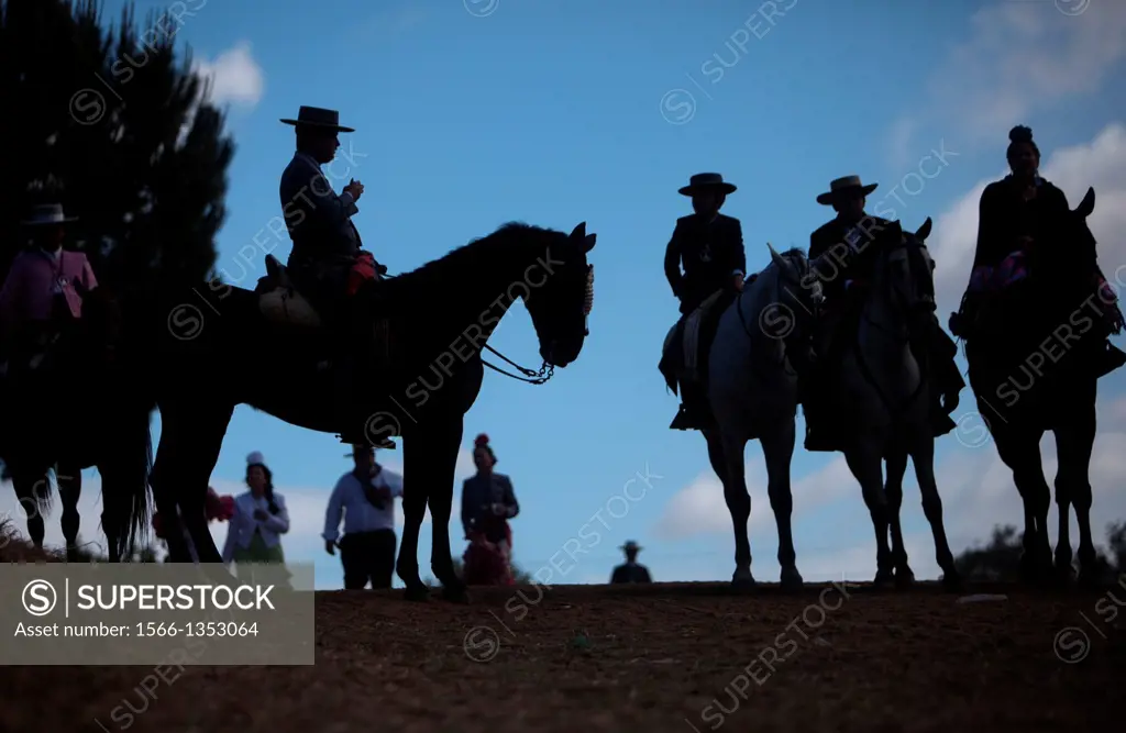 Riders wait to cross in the Guadiamar´s river ford, known as Vado del Quema, during the pilgrimage to the shrine of the Virgin of Rocio, in Aznalcazar...