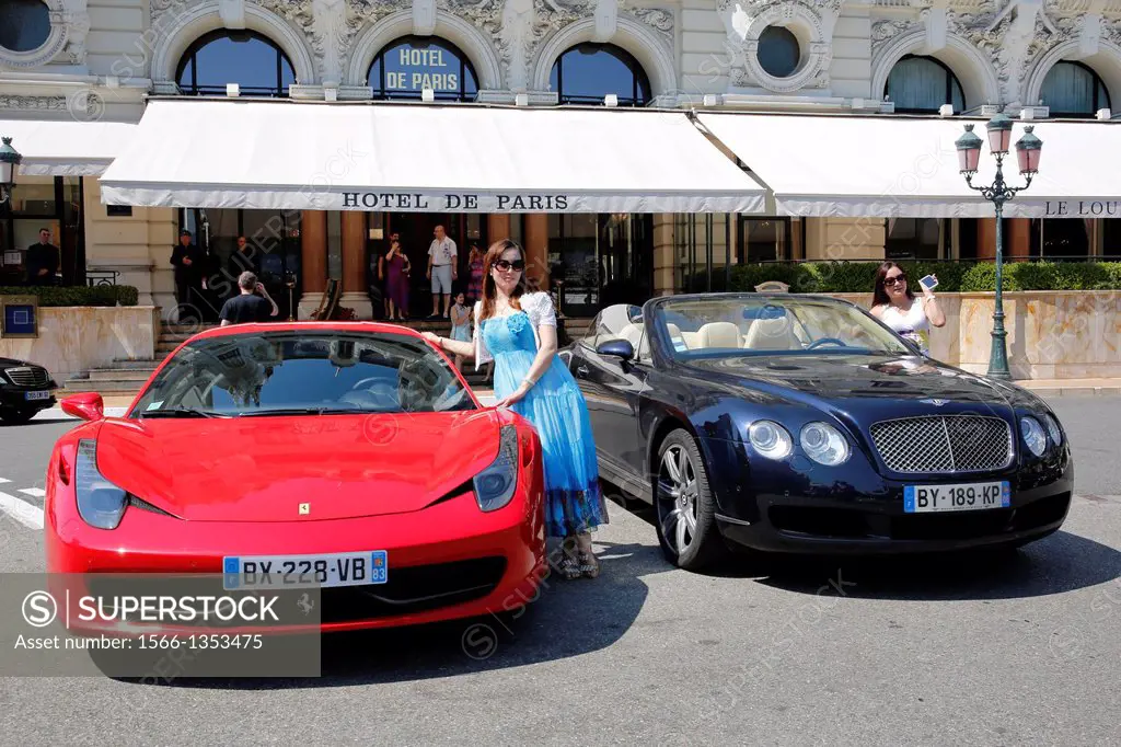 Europe, Principality of Monaco, tourists looking at luxury cars dropped by rich people at Casino or Hotel De Paris valet portiers, all properties of S...