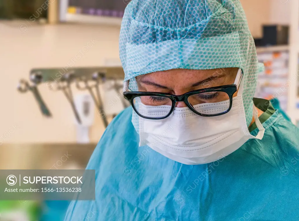 Surgical nurse-Heart valve replacement surgery, operating room, Reykjavik, Iceland.
