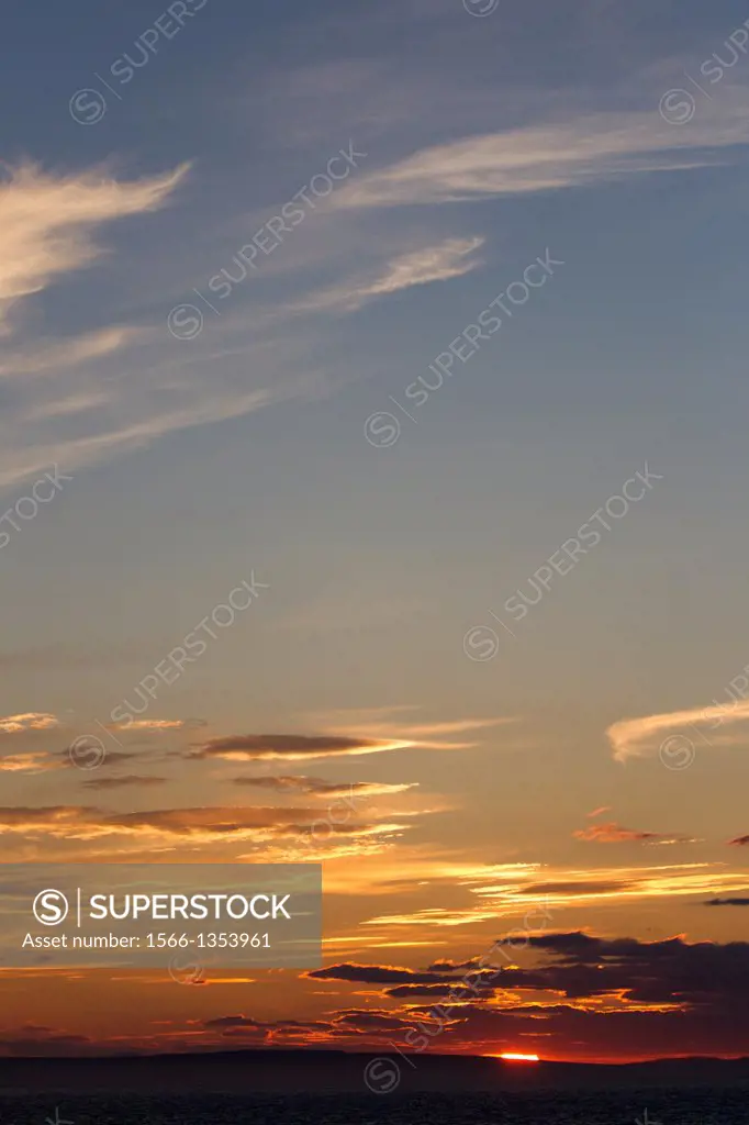 Russia , Chukotka autonomous district , sunset with the mountains in the background.