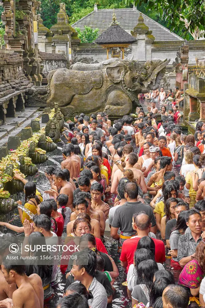 Bath in Tampaksiring sacred spring, Pura Tirta Empul Temple, Bali, Indonesia.