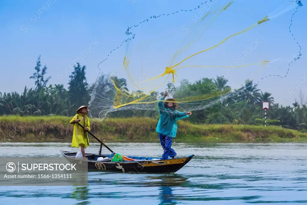 Fishing boats in the Thu Bon River near Hoi An, Vietnam, Asia.