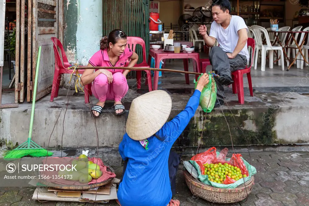 A street vendor selling fresh produce in Hanoi, Vietnam, Asia.