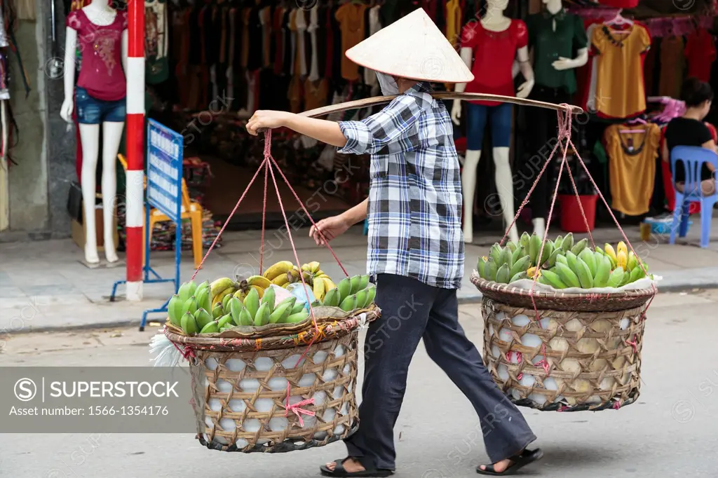 A street vendor selling fresh produce in Hanoi, Vietnam, Asia.