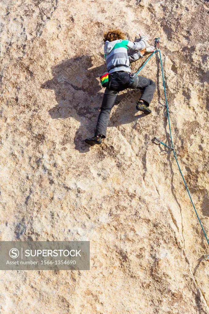 Rock climber in the Joshua Tree National Park, California, USA