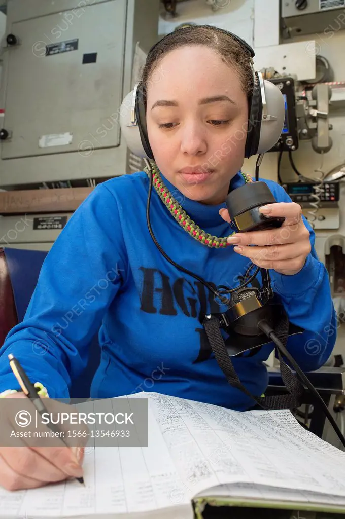 ATLANTIC OCEAN (Dec. 17, 2016) Seaman Kristal Williams annotates a logbook entry in the flight deck control office aboard the aircraft carrier USS Geo...