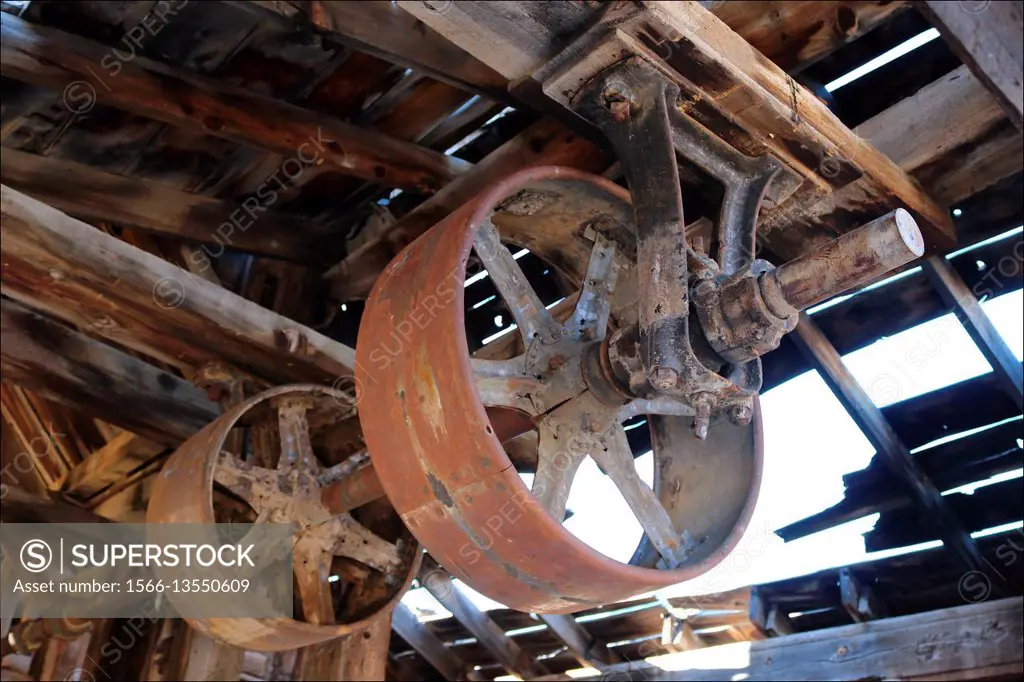 Drive pulleys rust away in the abandoned Masonic Mine in Bridgeport, California, USA